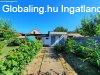 Szandaszlsn sarki telken, kzepes llapot, szigetelt tg